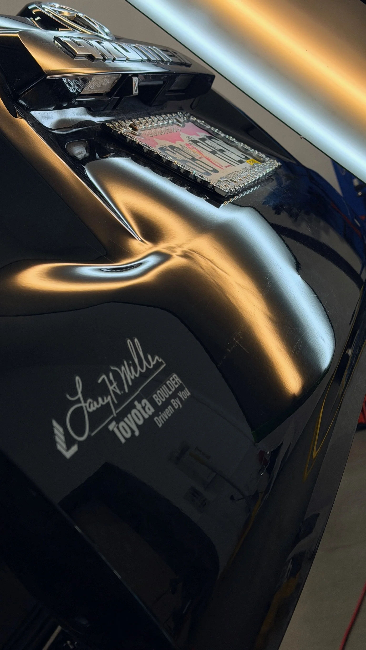 Rear bodyline dent before precision paintless dent repair