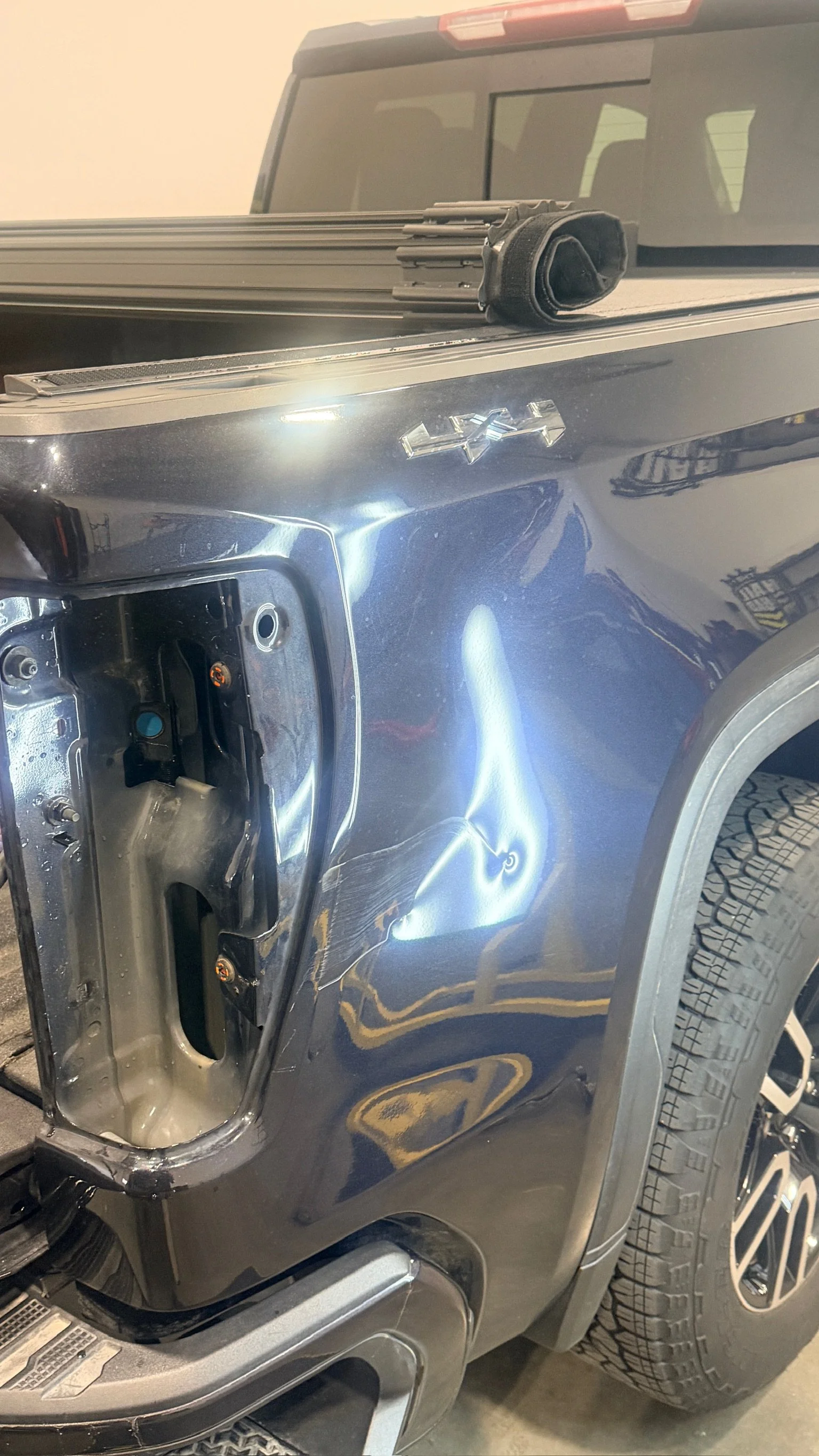 Rear quarter panel dent and crease before paintless dent repair