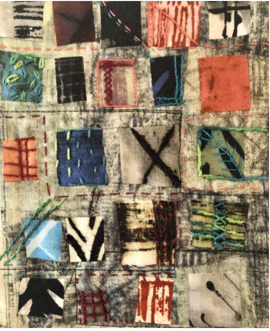 Close-up of a patchwork quilt with various colorful fabric squares, stitched together with different colors of thread, featuring patterns like stripes, checks, and abstract designs.