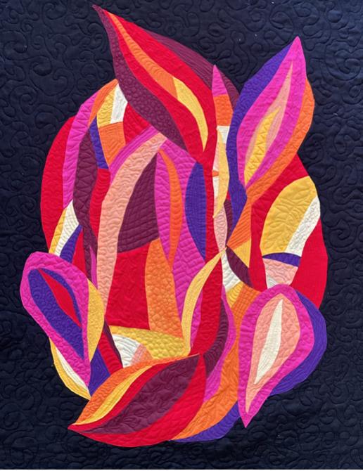 Colorful abstract quilt design with leaf shapes in shades of pink, red, orange, purple, yellow, and white on a dark background.