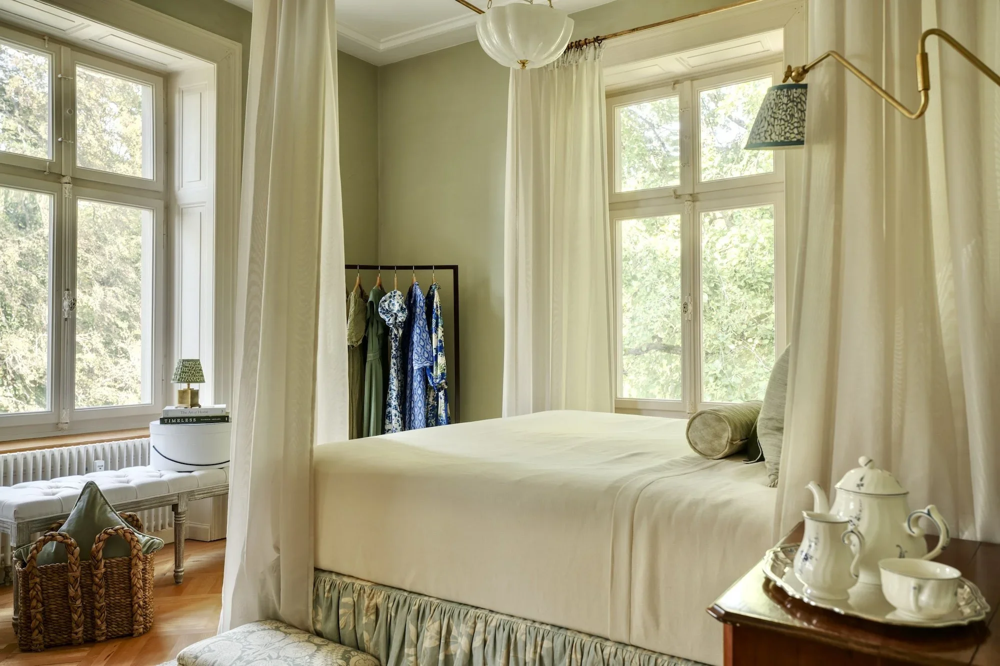 English country house bedroom with Farrow & Ball French Gray walls, a sheer bed canopy and a skirted bed in Lewis & Wood Doves fabric