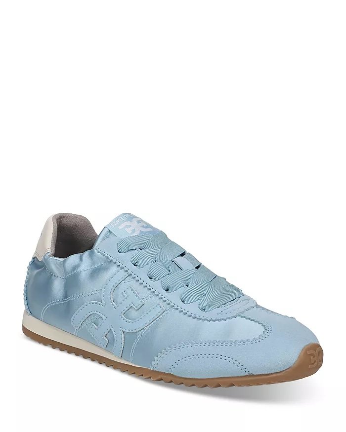 Light blue sneaker with beige sole and gray interior, featuring embroidered logo on the side
