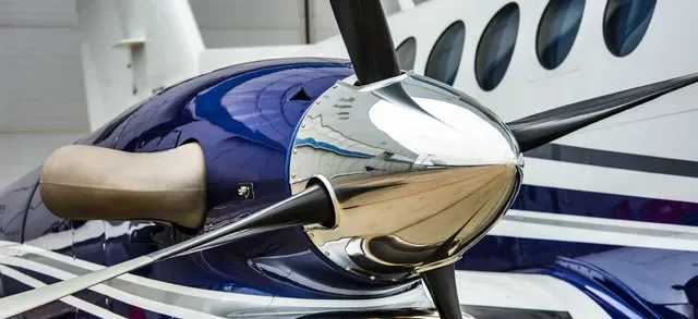 Polished propeller spinner and glossy blue paint after aircraft polishing and wax