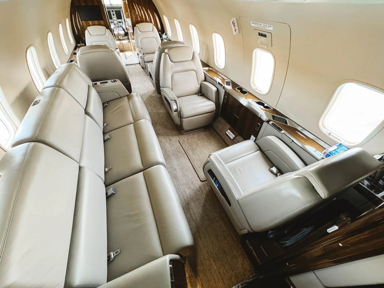 Private jet cabin with clean leather seats after aircraft interior detailing