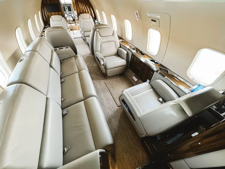 Private jet cabin with clean leather seats after aircraft interior detailing