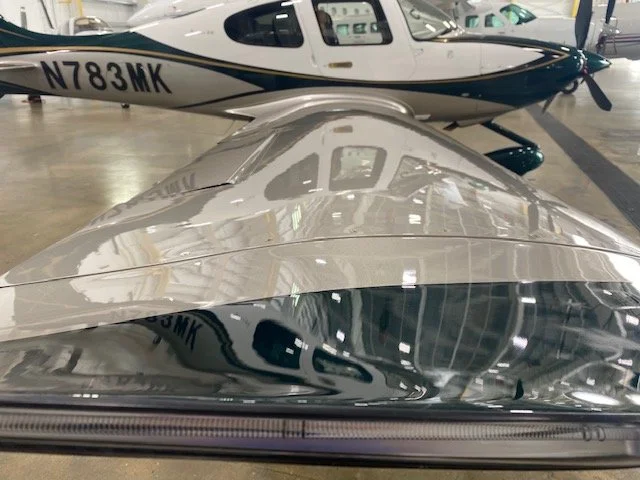 White private aircraft with a high-gloss finish after a ceramic coating