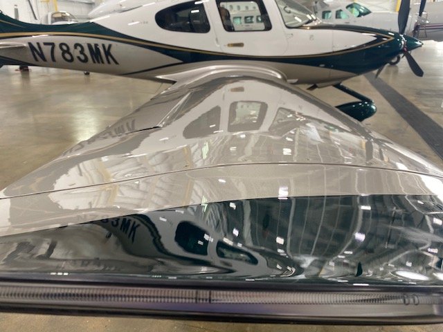 White aircraft with a high-gloss finish after System X ceramic coating
