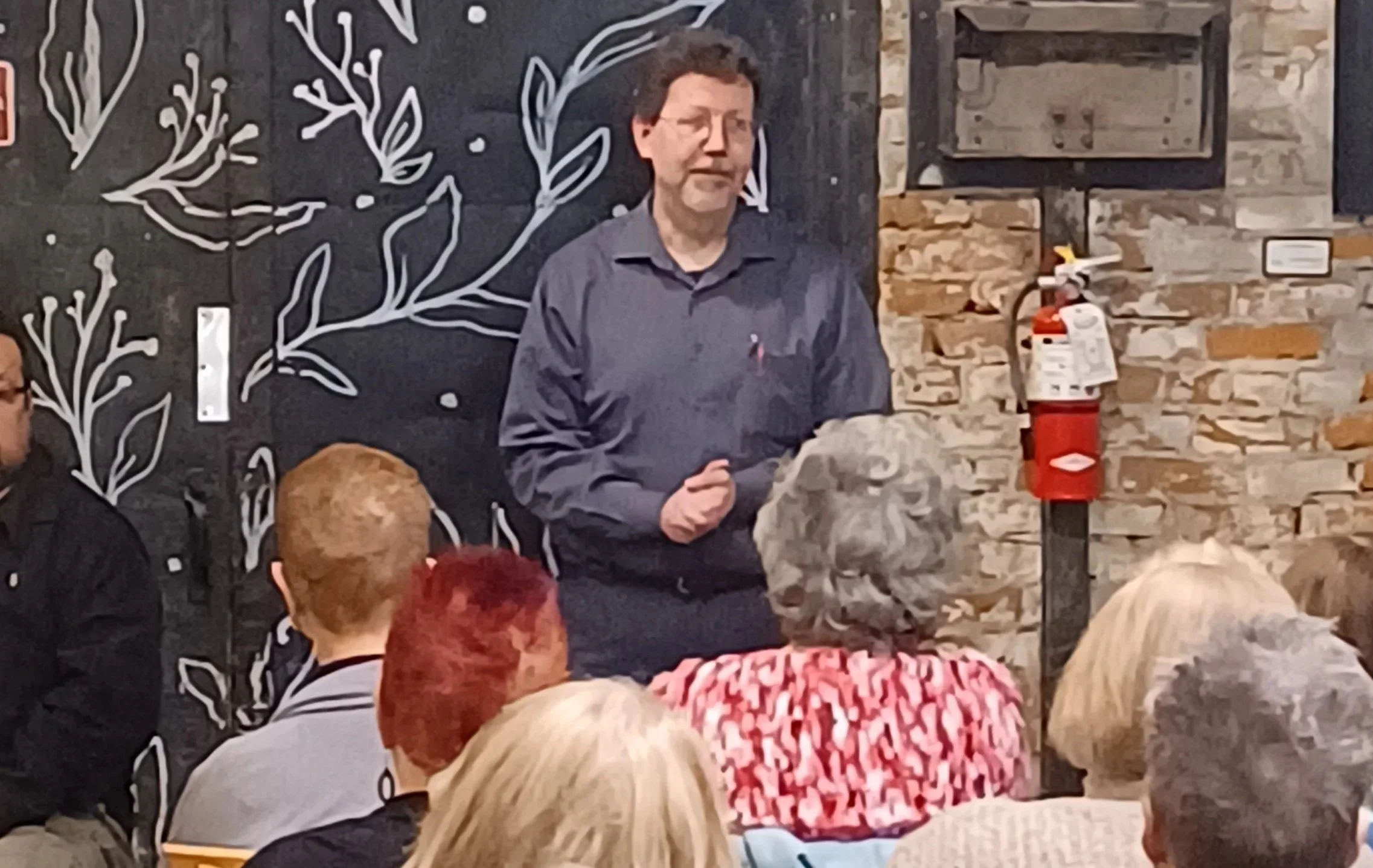 Michael Delaware presenting stories at the Michigan True Crime Symposium.