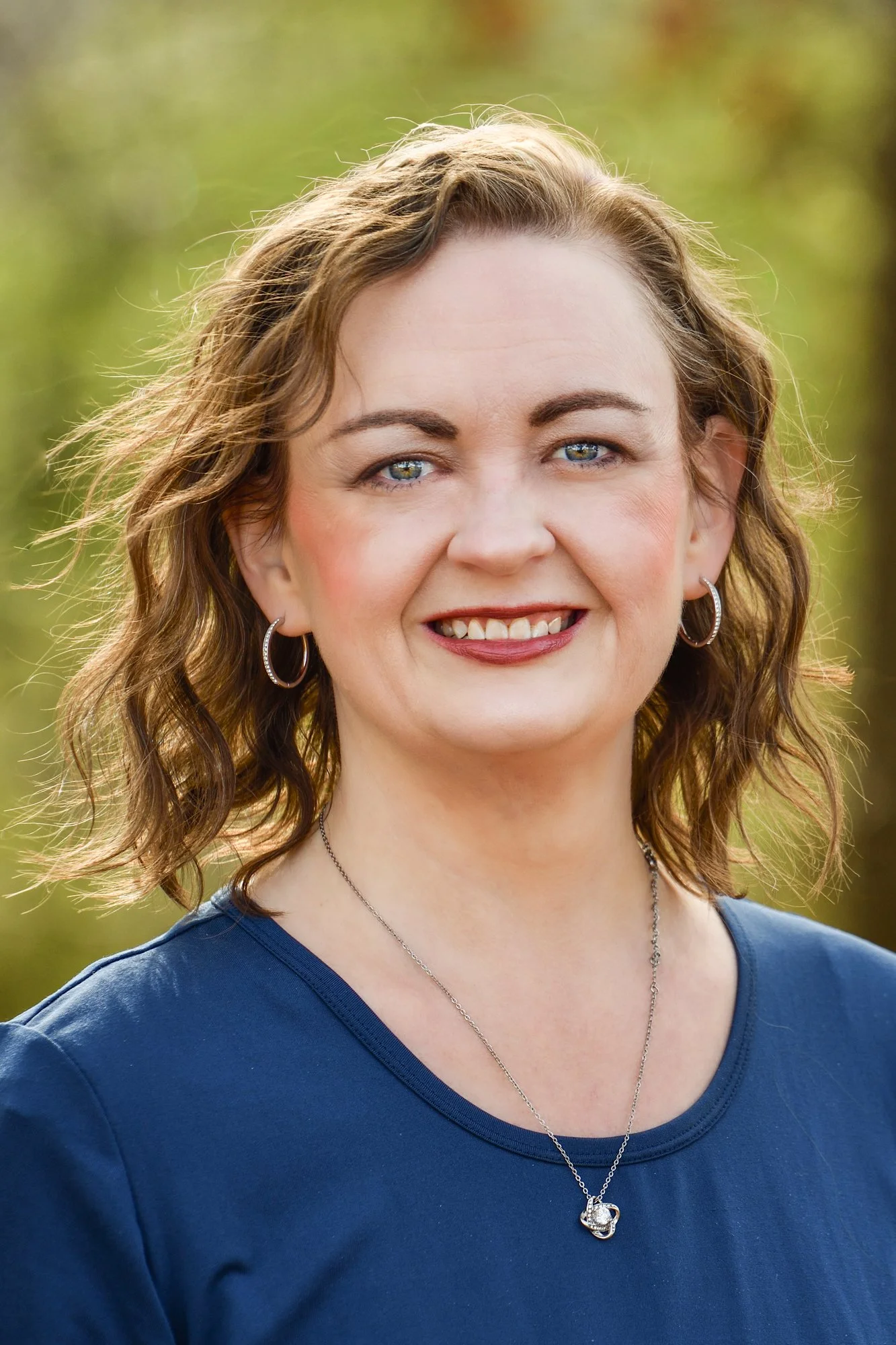 A headshot of Amber L Edwards floral Fine art photographer