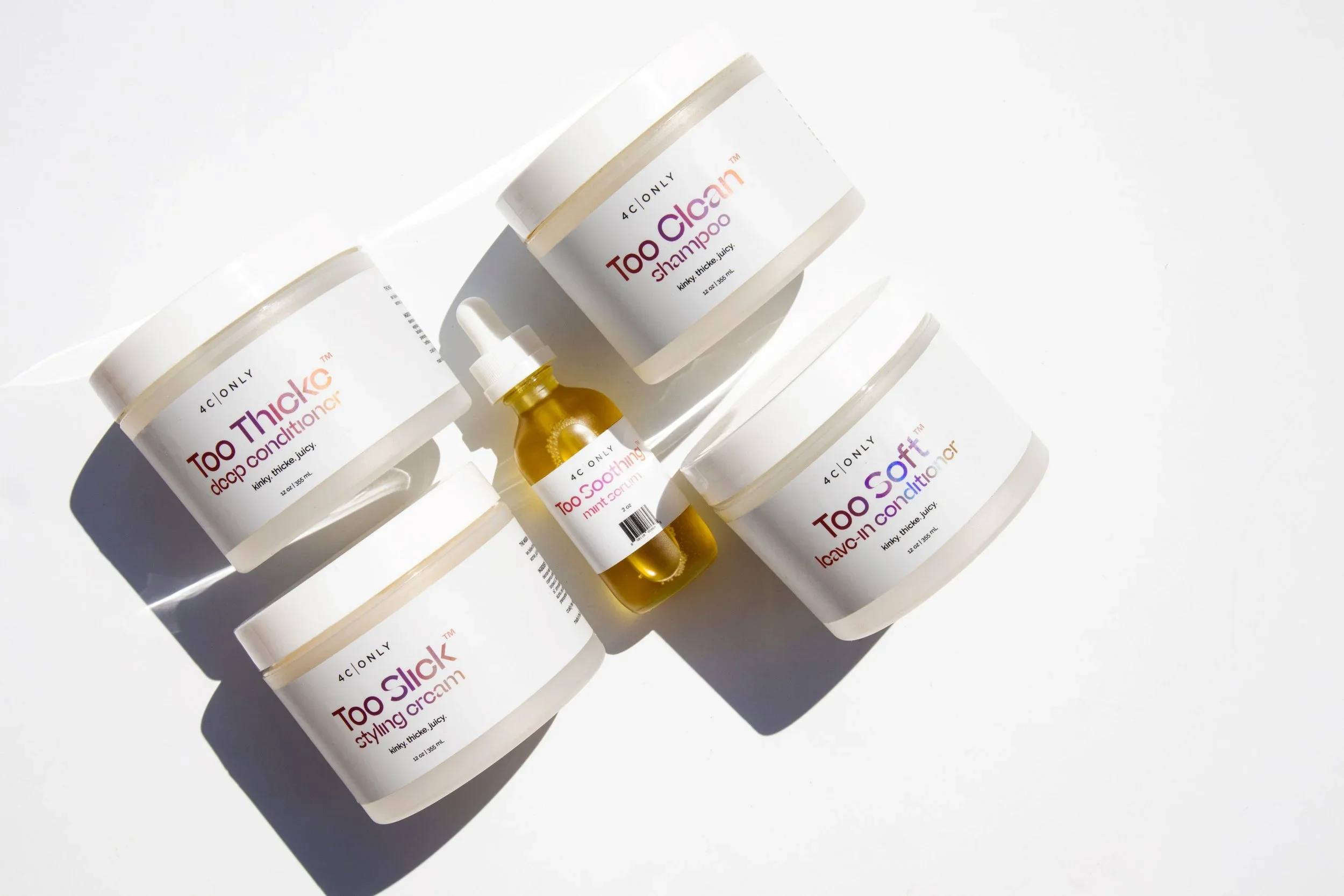 4C ONLY product lineup with jars and serum photographed on white