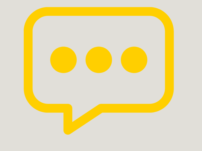 Yellow speech bubble with three dots on a light background.