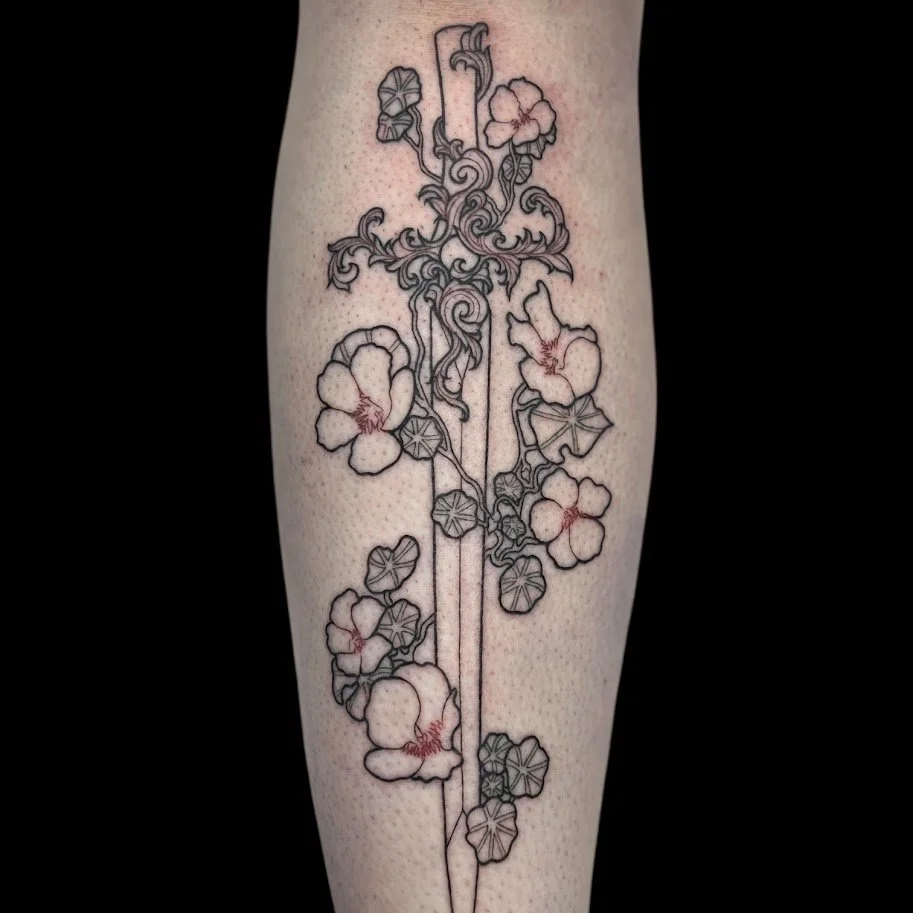Line drawing tattoo of flowers and leaves on a person's arm, with some colored shading and details.