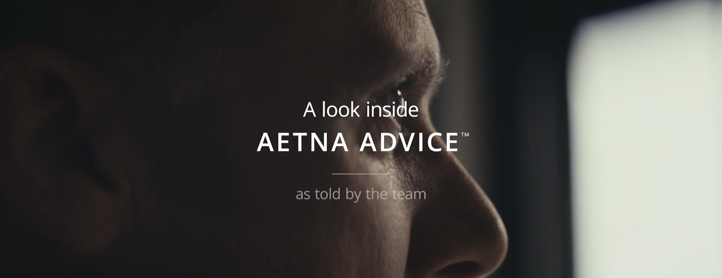 Close-up of a person's face with the text overlay: 'A look inside AETNA ADVICE™ as told by the team'.