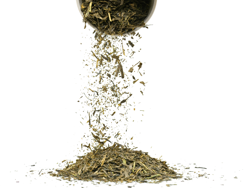 Dried herbs being poured from a container onto a pile.