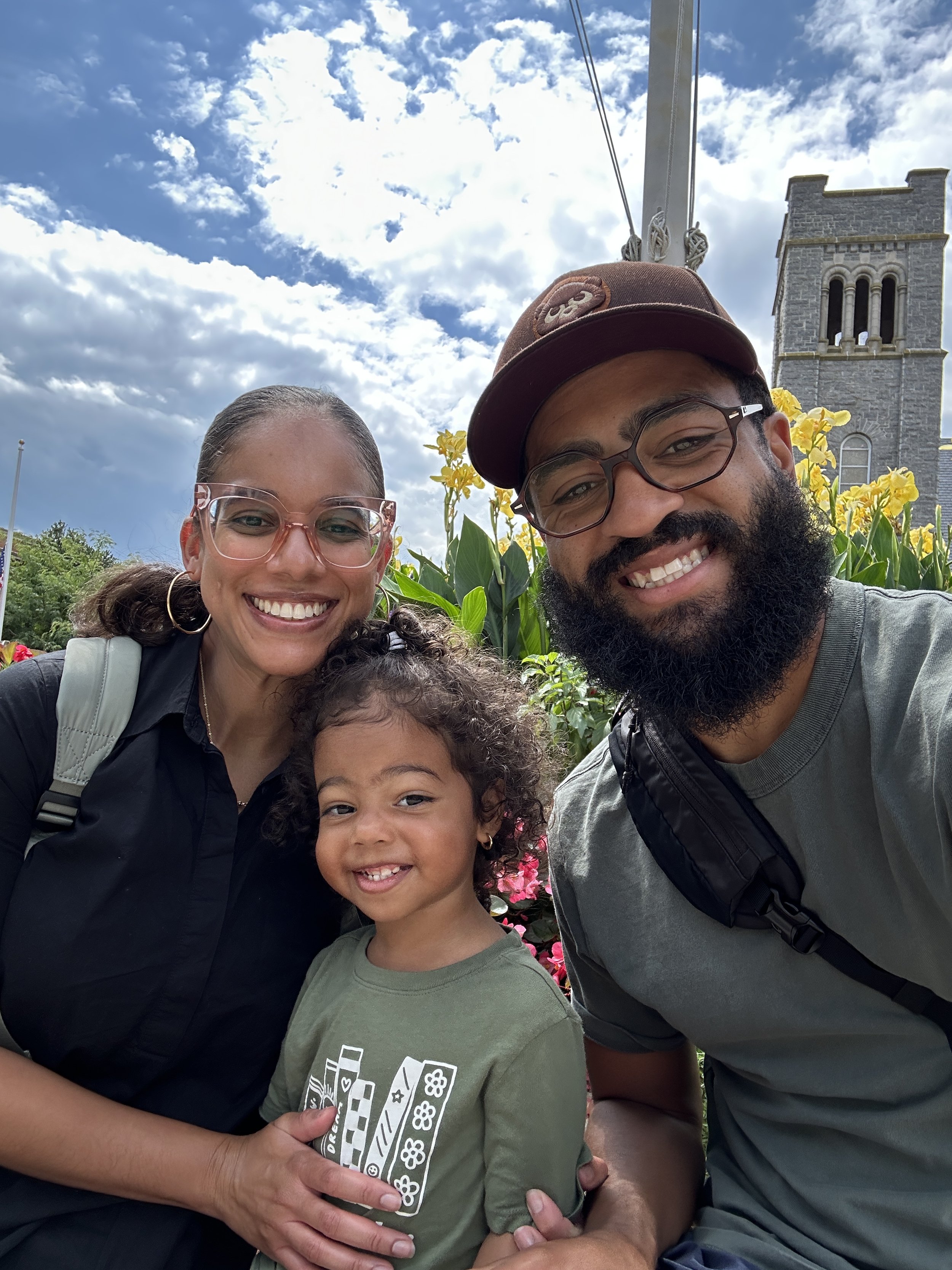 Family smiling outside