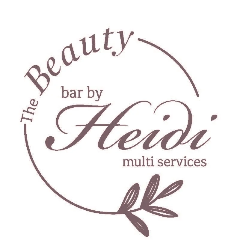 Logo for 'The Beauty Bar by Heidi,' a multi-service beauty business, featuring elegant script font and a decorative leaf element.