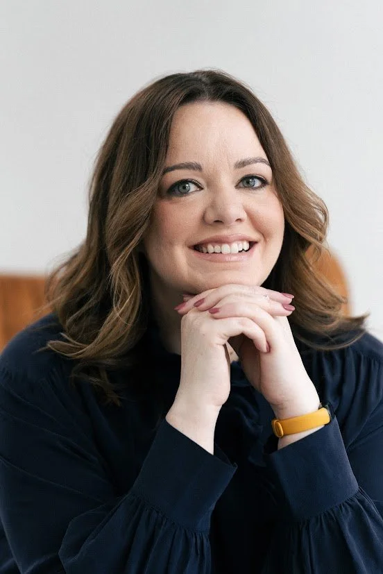 Irish ADHD coach smiling warmly, offering empathetic 1:1 coaching for high-performing tech professionals.