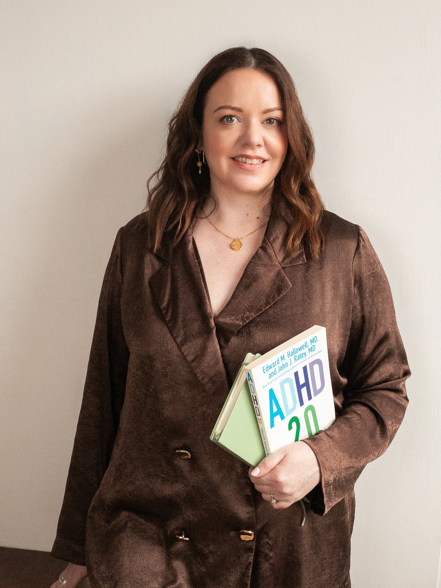 Former Google Leader and Irish ADHD coach holding the book ADHD 2.0, offering 1:1 coaching for tech professionals.