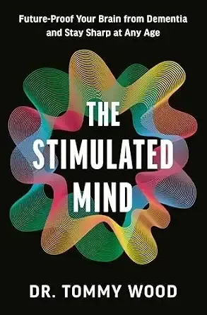 Book cover titled 'The Stimulated Mind' by Dr. Tommy Wood, with colorful abstract brain imagery on a black background.