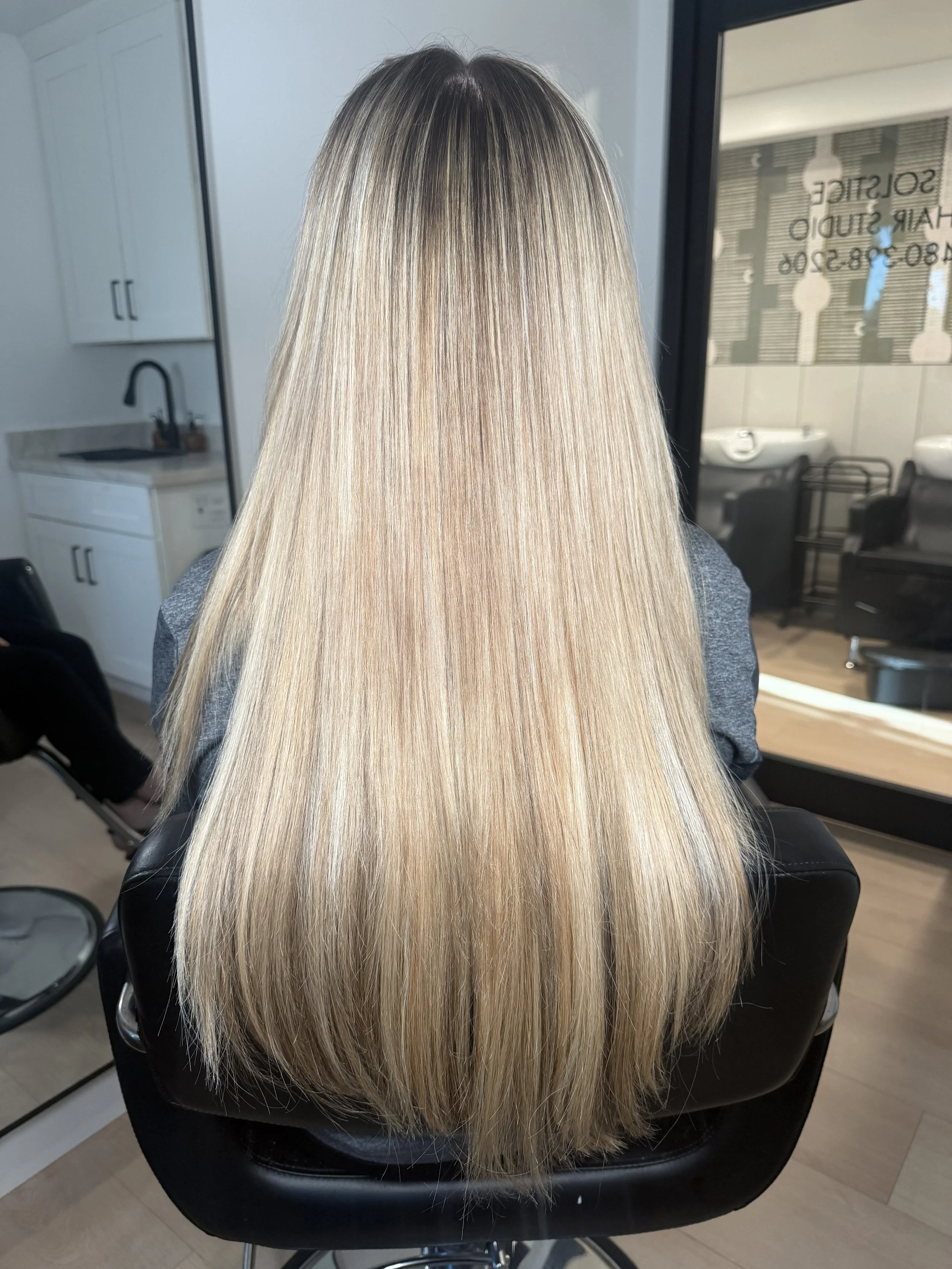Two Rows of Extensions and Bright Dimensional Blonde Highlights