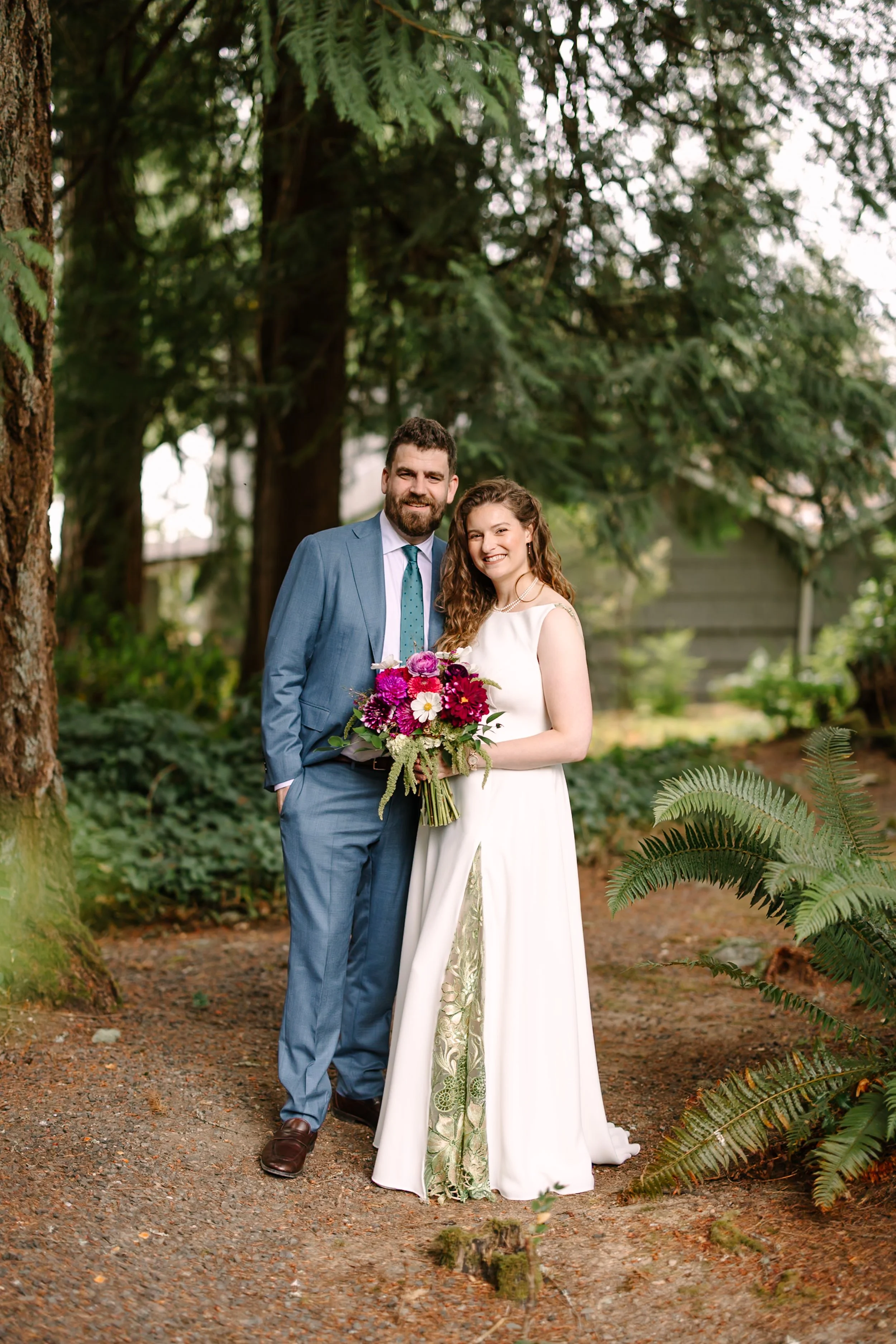 Image of bride and groom under canopy of trees