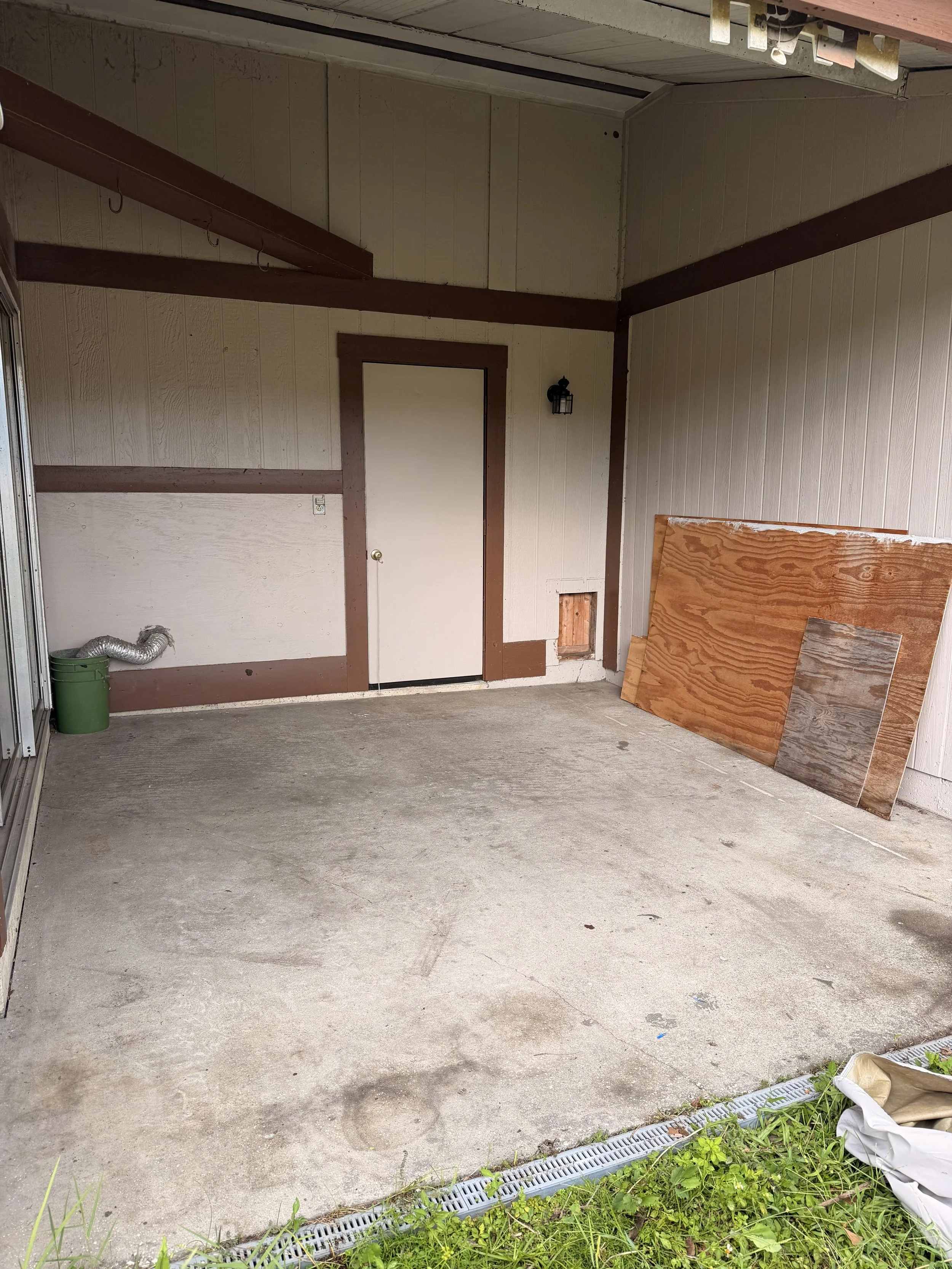 After photo of a completed porch and backyard cleanout in Orlando, FL with unwanted items and debris removed, leaving the outdoor space cleared.