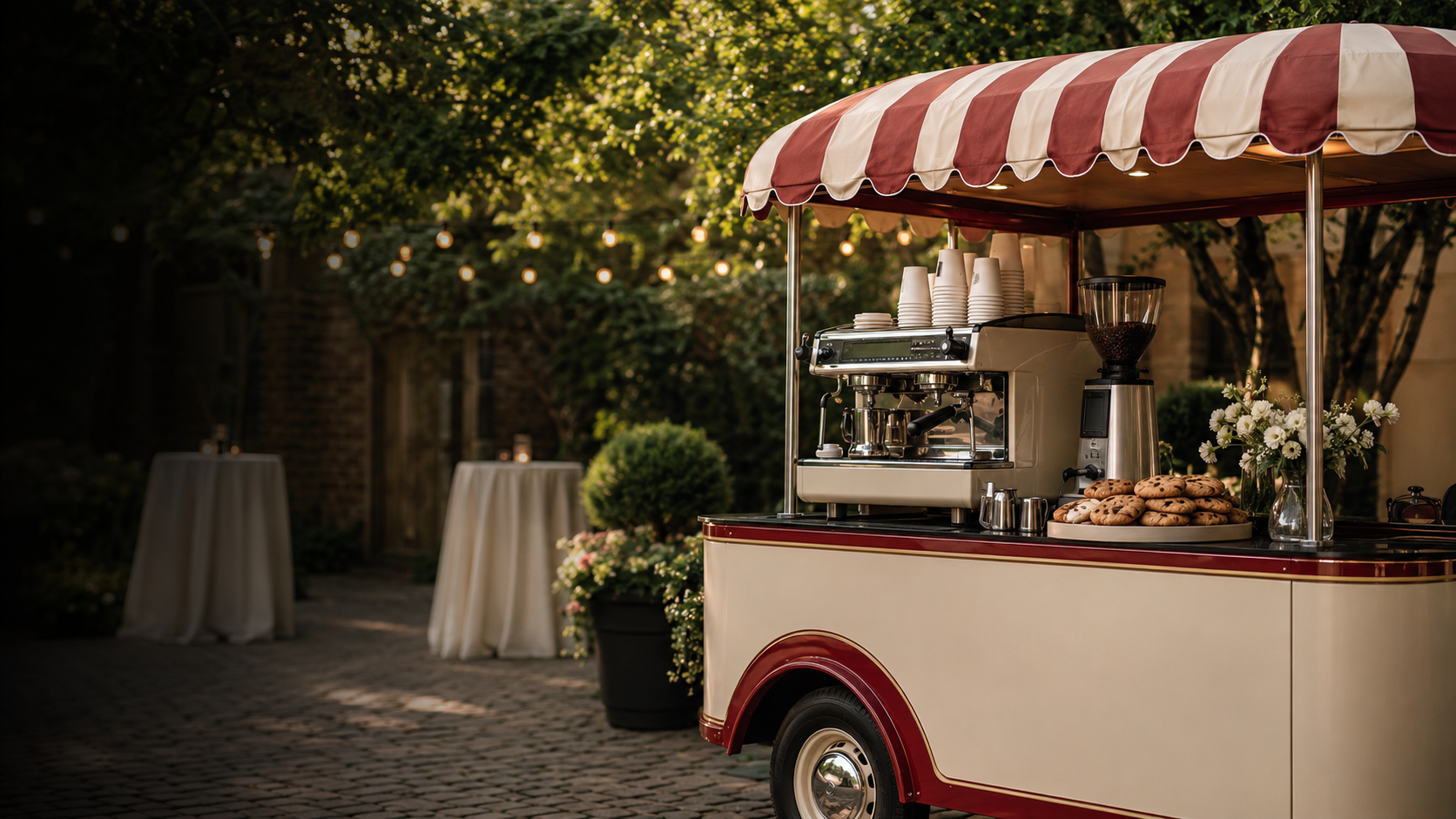 Cream and deep red mobile coffee cart serving espresso and fresh cookies at an outdoor Maryland event