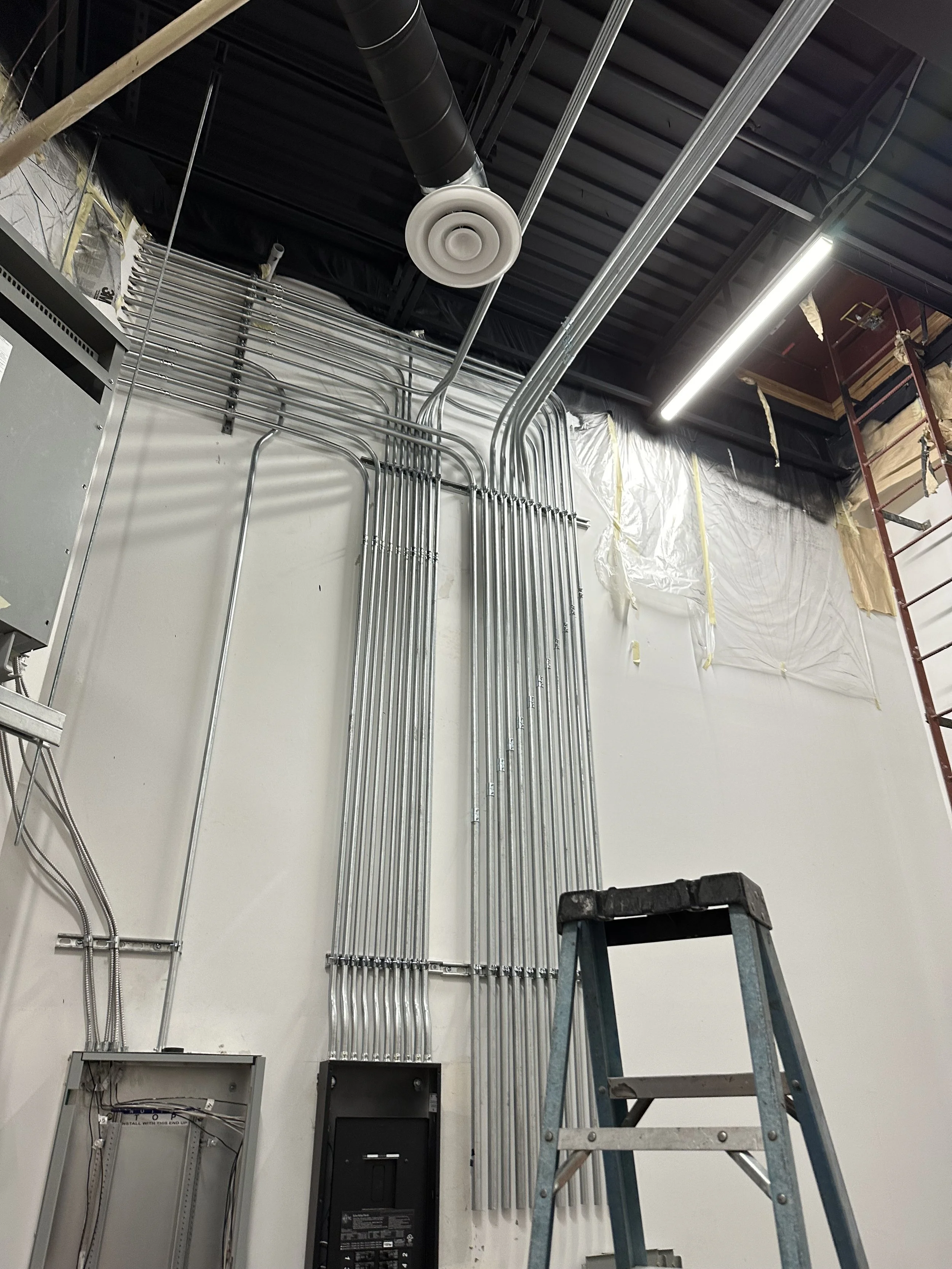 Electrical conduit installation in a commercial construction space