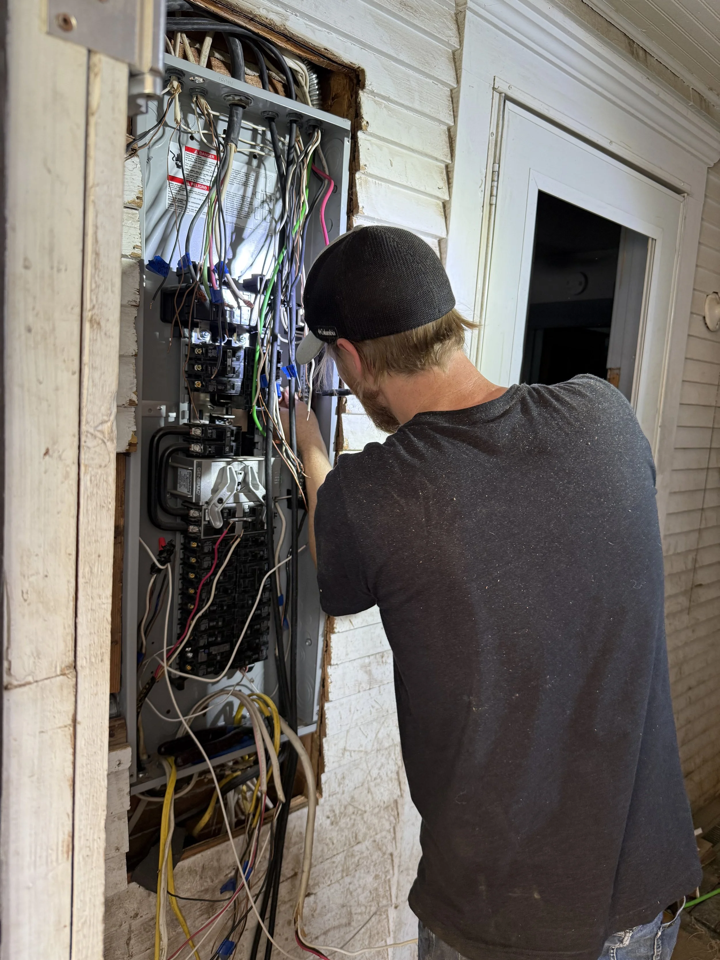 Clearlake Electric electrician working on a residential electrical panel
