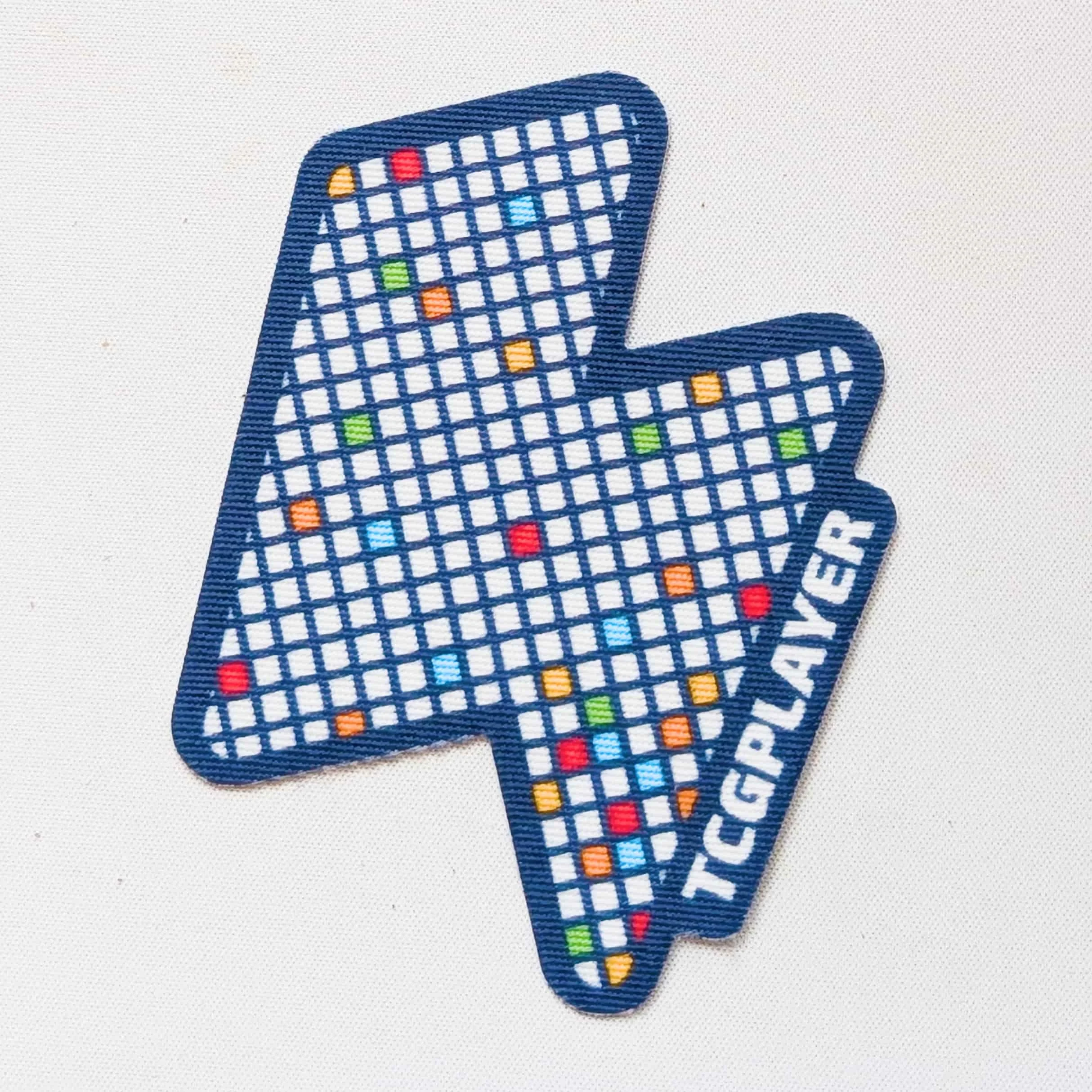 A canvas sticker design featuring TCGplayer core branding and a pixel design across a bolt shape.