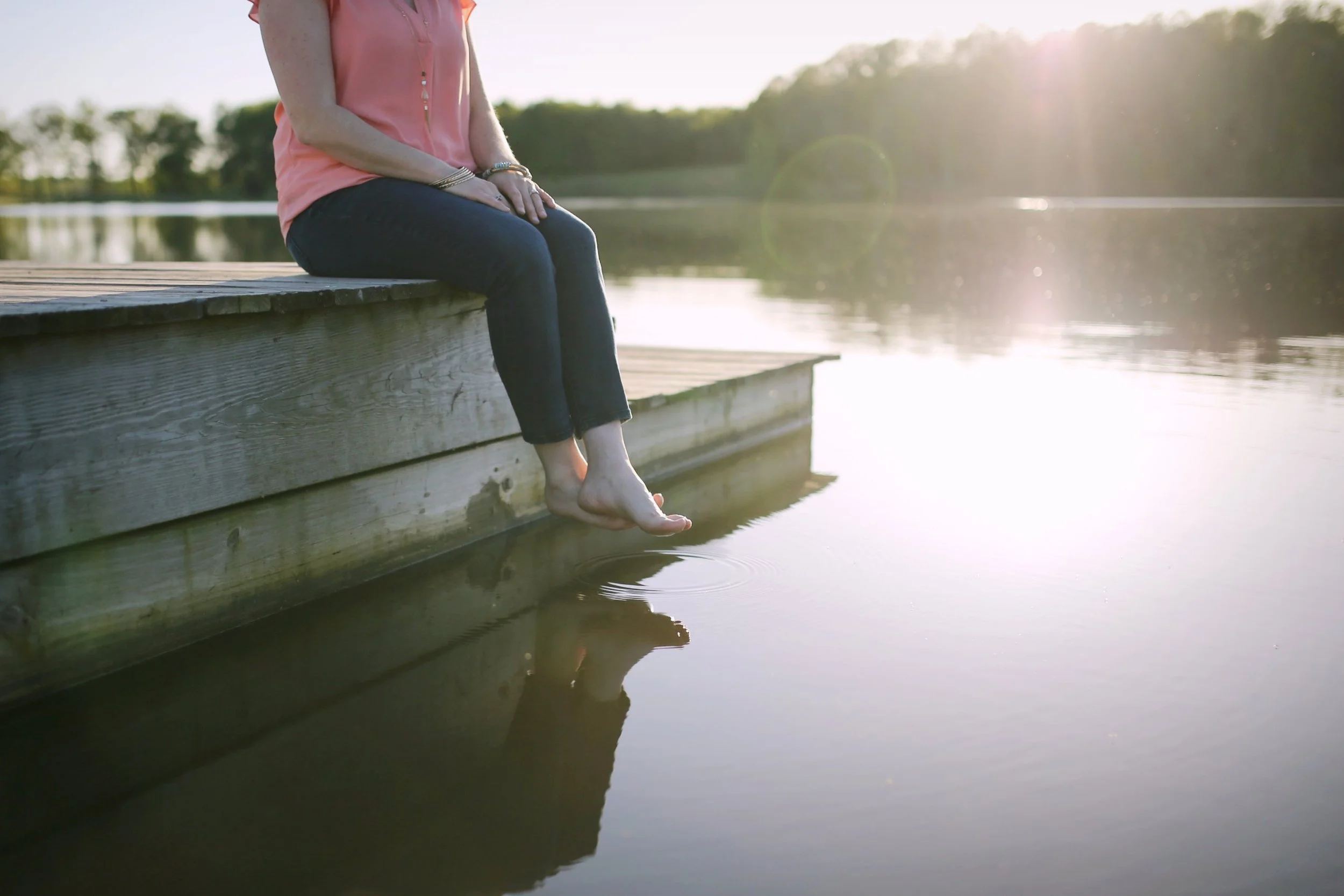 Laura Long sitting by the water