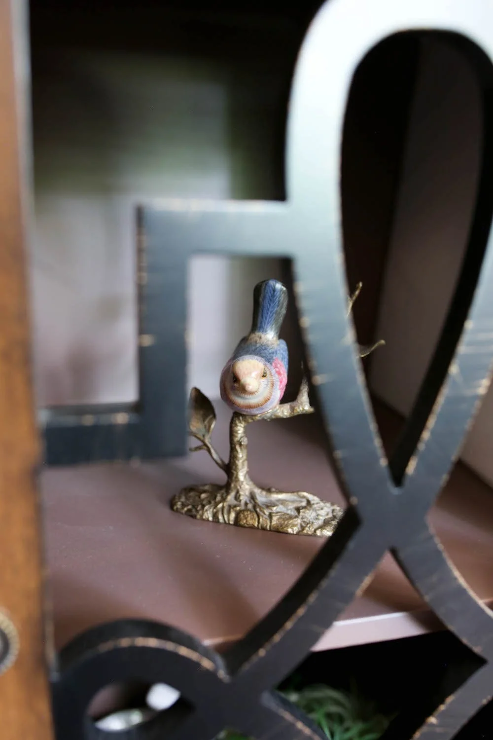 Bird decor on a shelf in Laura Long’s office in Five Forks, SC