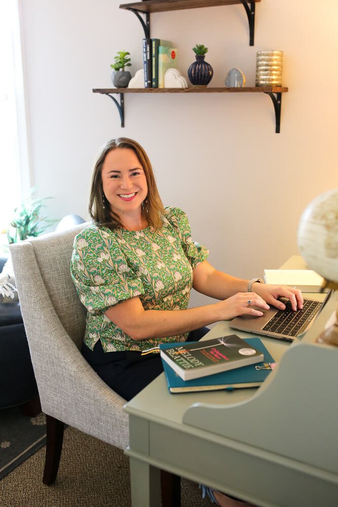 Laura Long sitting at her desk