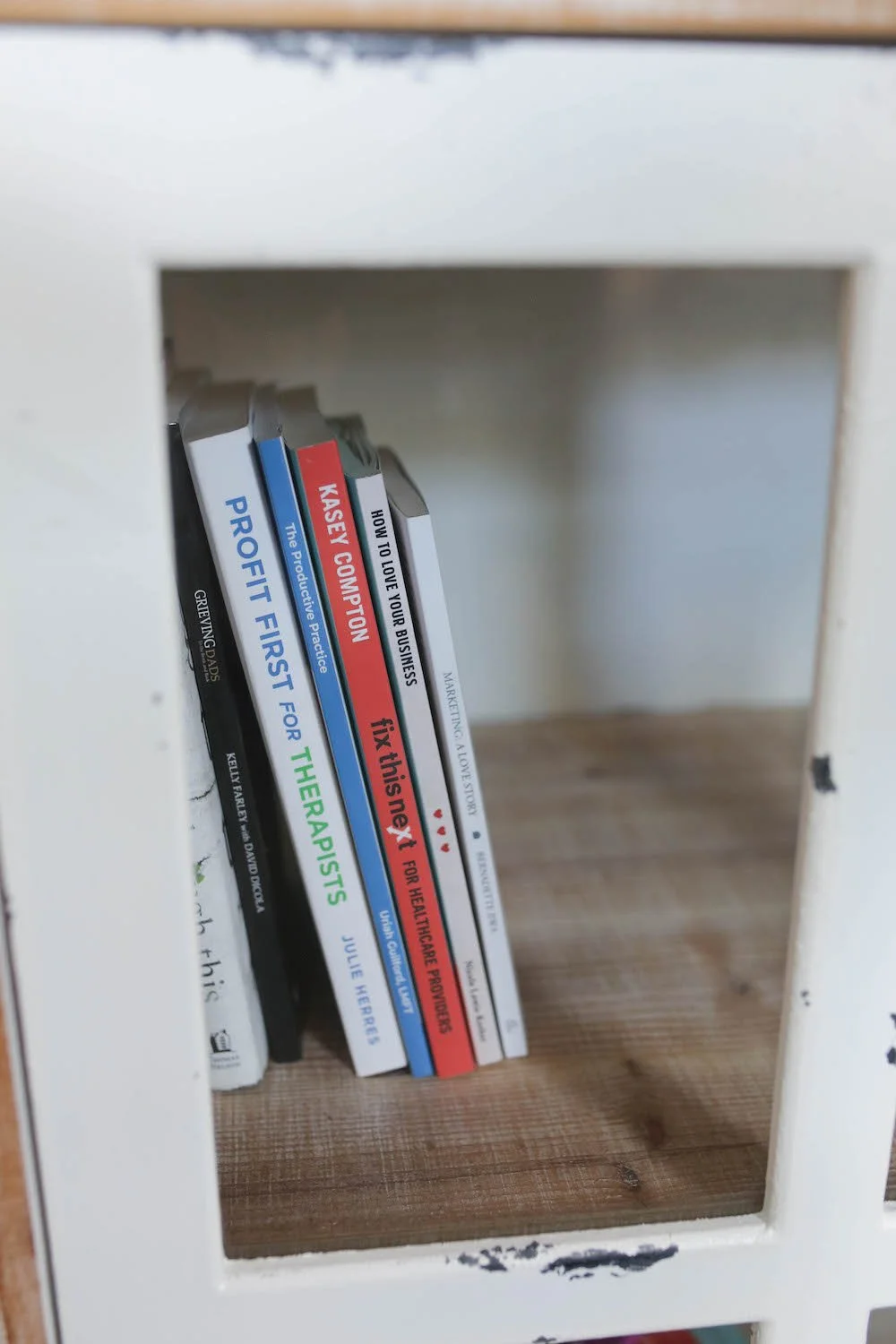 Business and private practice books on a shelf