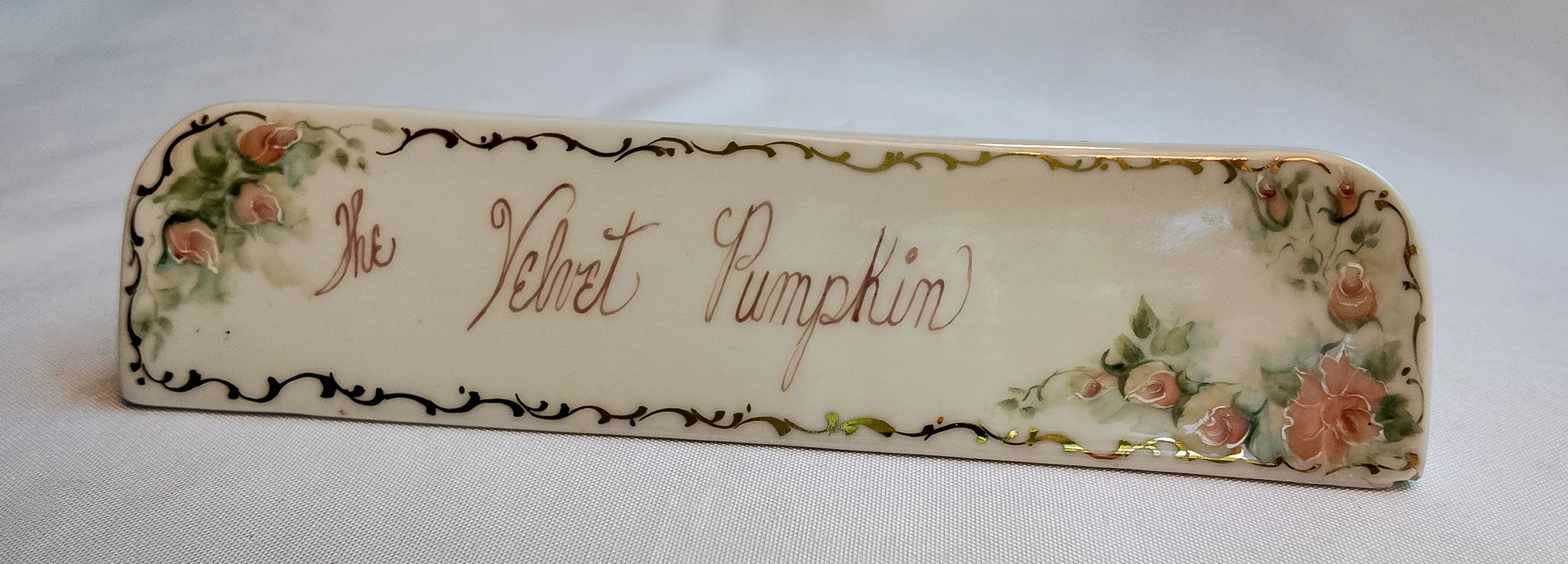 We Have No Idea Either: 'The Velvet Pumpkin' Porcelain Sign