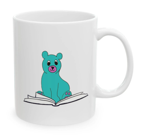 White mug with a cute teal bear sitting on an open book, pink paws and nose, and cartoon style.