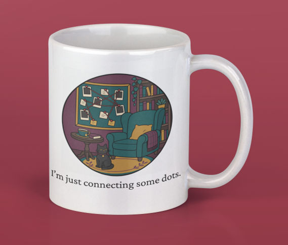 White coffee mug with a cartoon illustration of a cozy reading nook, featuring a blue armchair, a bookshelf, and a cat, with the text 'I'm just connecting some dots'.