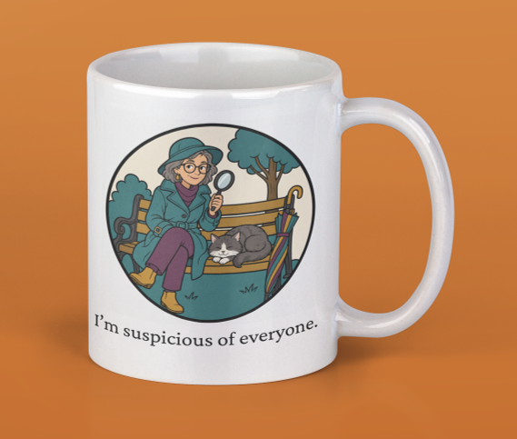 White ceramic mug with a cartoon illustration of a woman in a blue coat and hat sitting on a park bench, holding a magnifying glass, with a sleeping gray and white cat beside her and an umbrella leaning against the bench. Text on the mug reads 'I'm suspicious of everyone.'