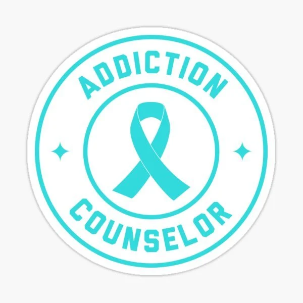 A sticker with a teal ribbon in the center, surrounded by the words 'ADDICTION COUNSELOR' in teal, circle outlined in teal, on a white background.