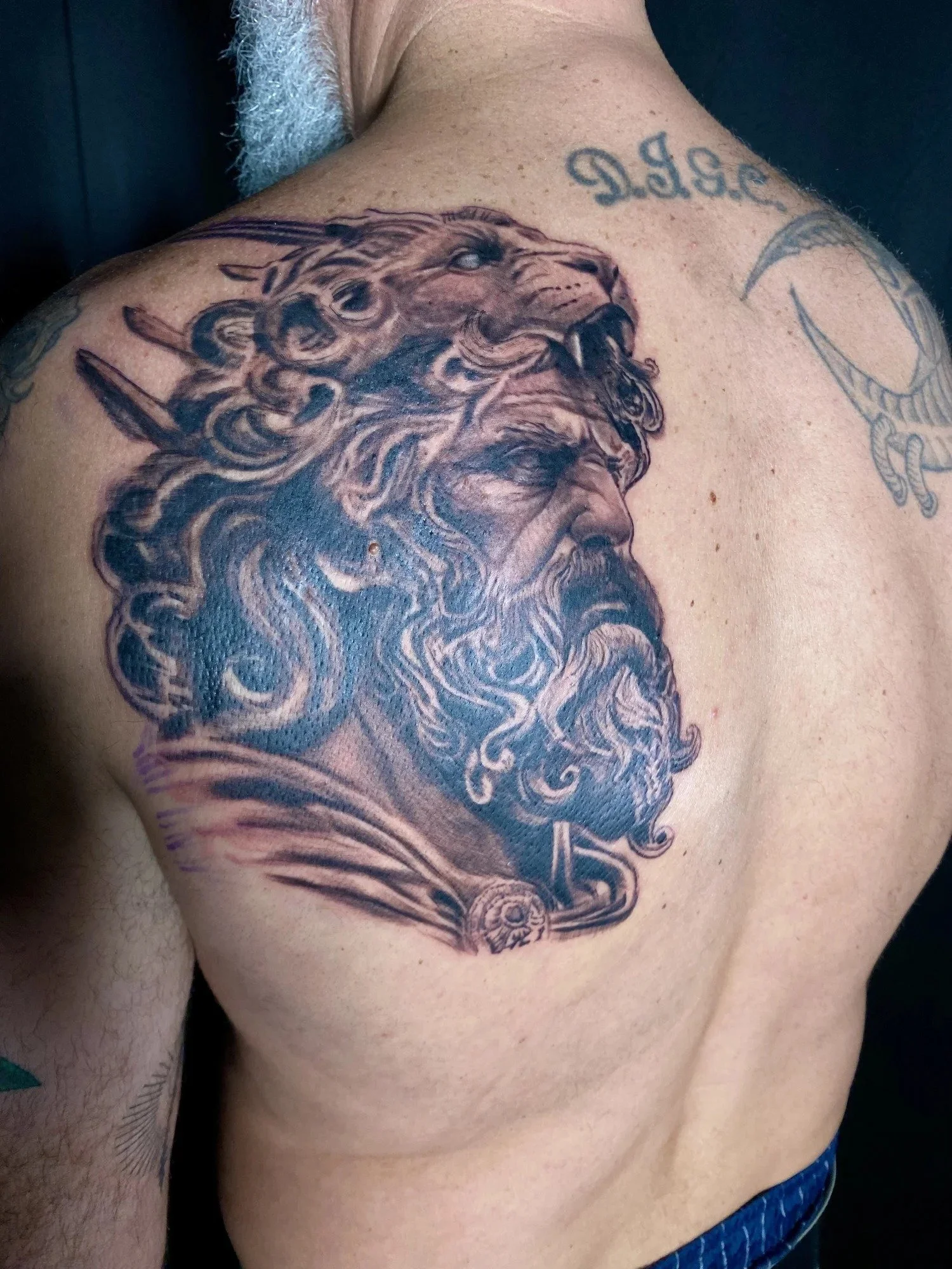 Black and grey realism Hercules tattoo on upper back by Esteban, San Diego tattoo artist