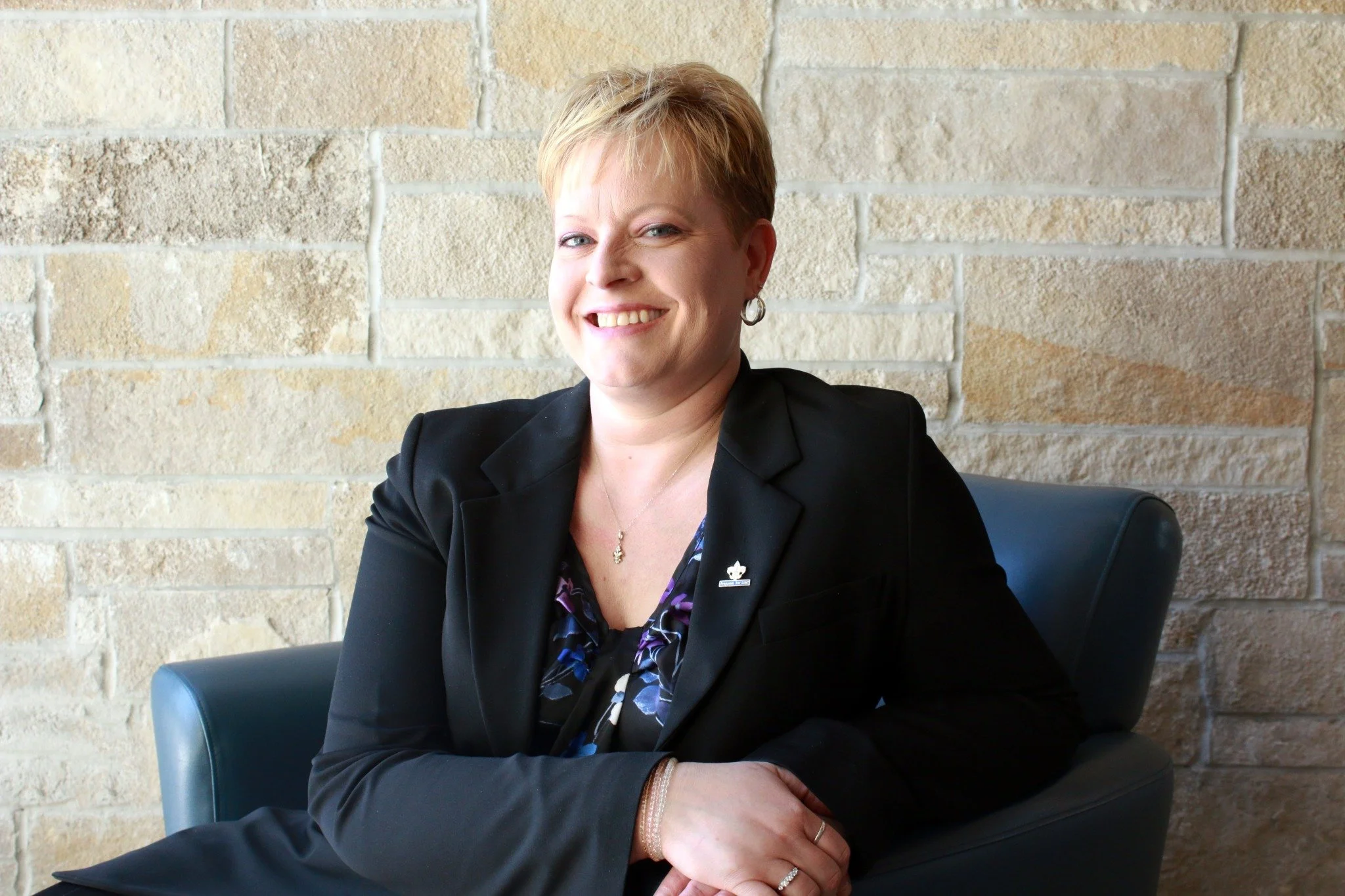 Keri Roby seated in a community setting