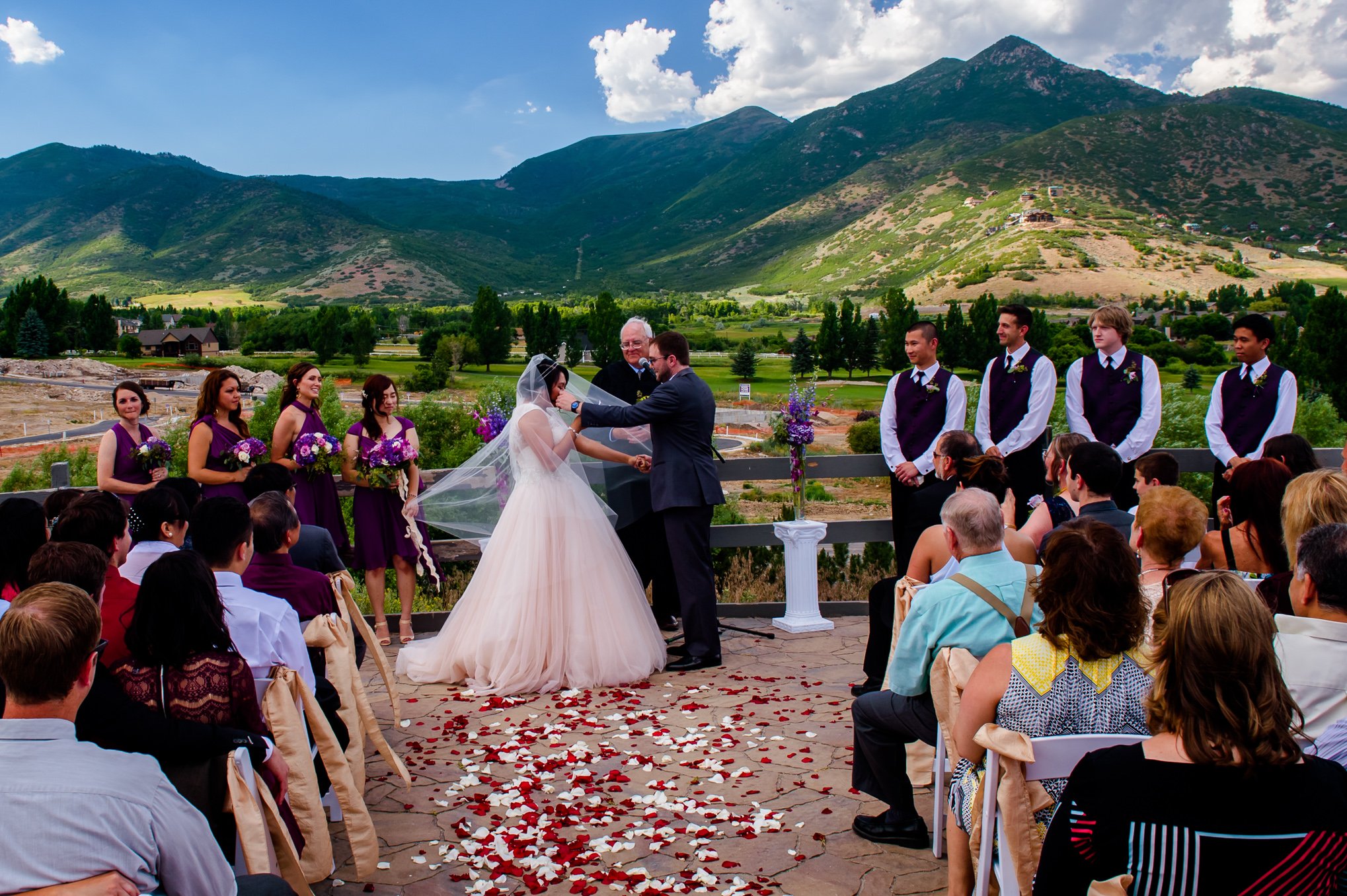 A touching moment where the groom wipes a tear from the bride's face in Heber Utah