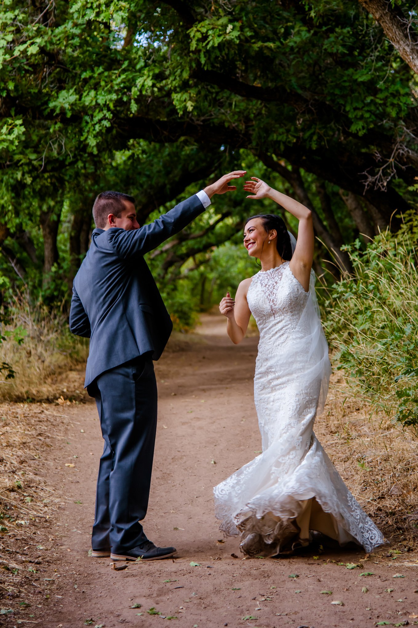 Bride and groom dancing in the trees at Red Butte Garden