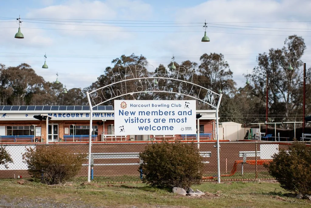 Sign at Harcourt Bowling Club welcoming new members and visitors