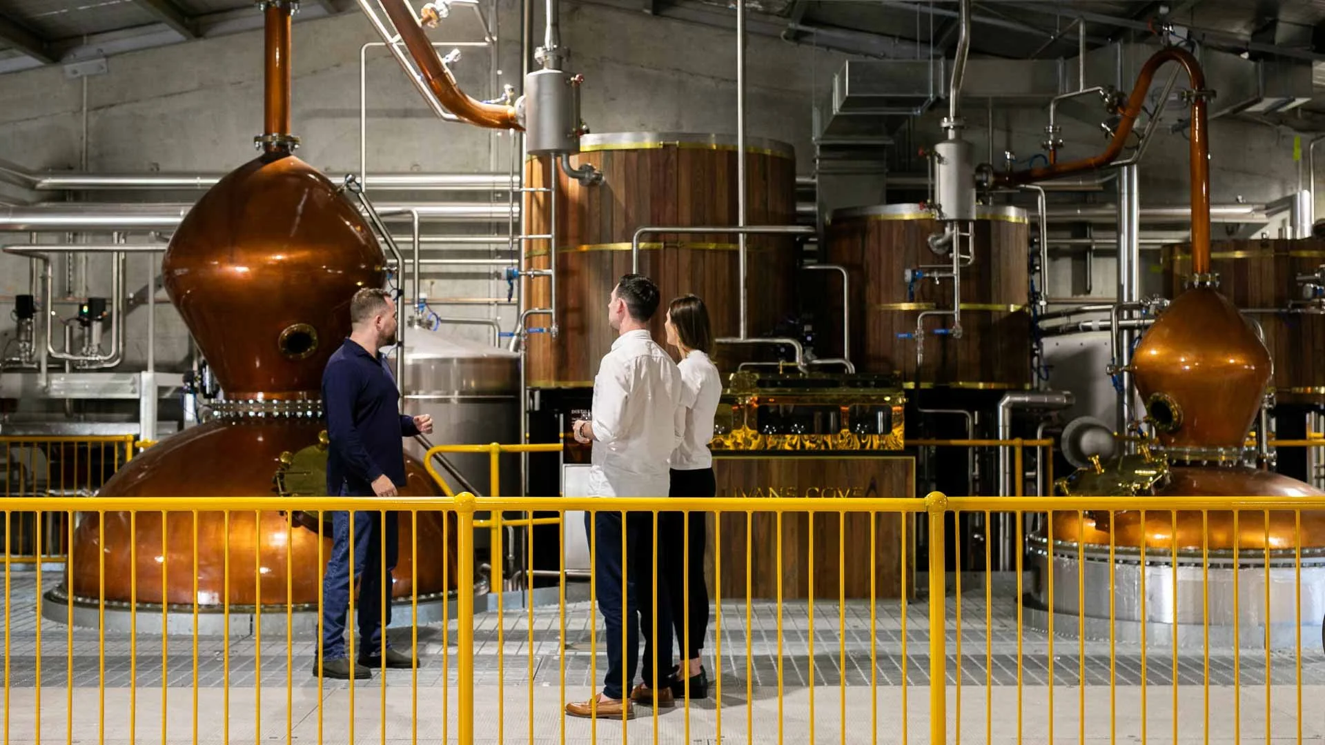A couple enjoying a distillery tour at Sullivans Cove Distillery