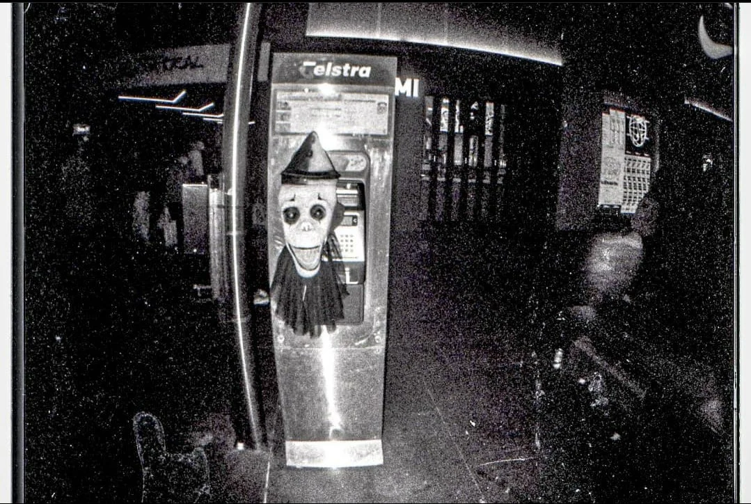 Shot on 35mm b&w film. A scary telephone box.