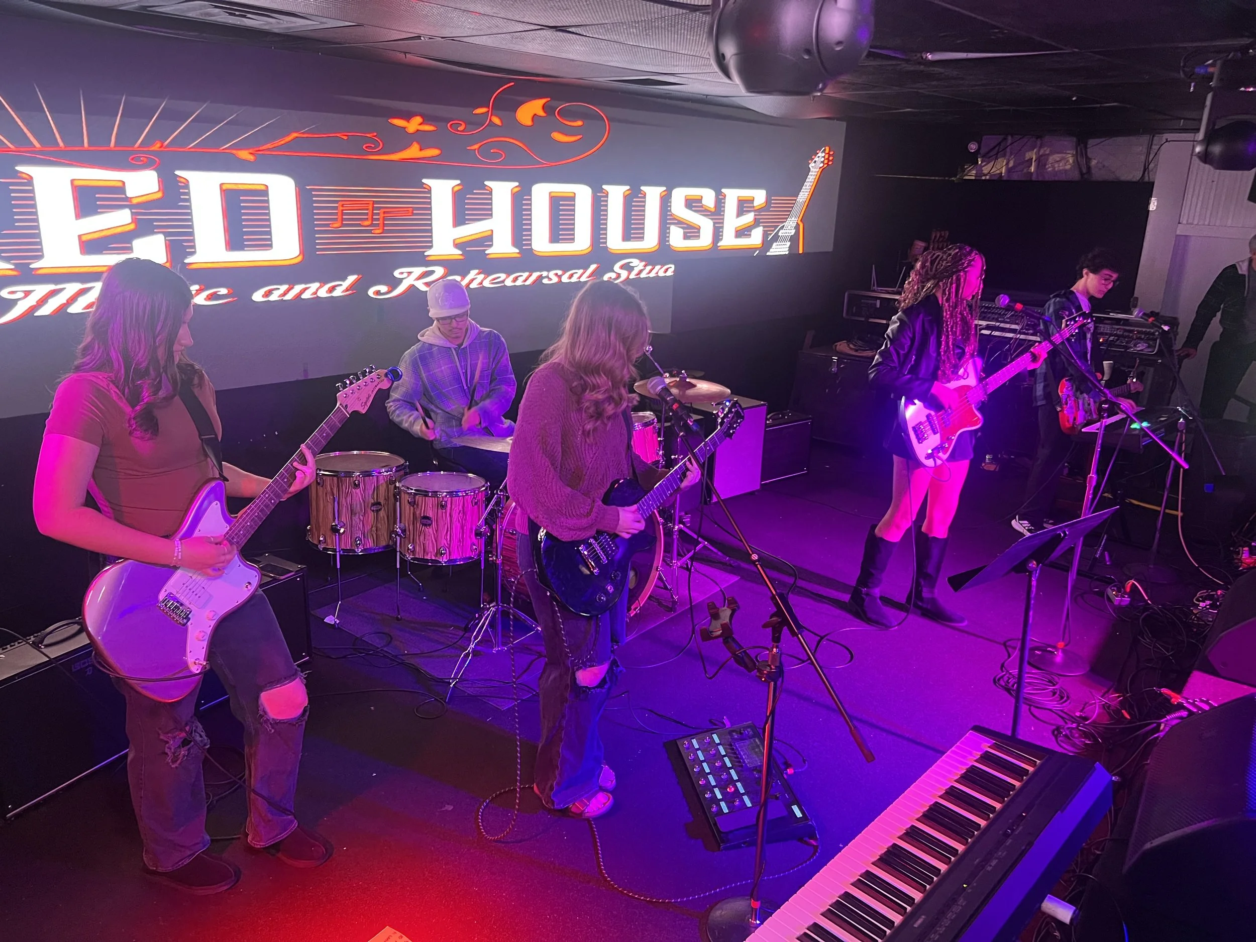 A band of young music students from Red House Music and Rehearsal Studio (Point Pleasant, NJ) performing on stage at a venue called Headliner Nightclub in Neptune, NJ.