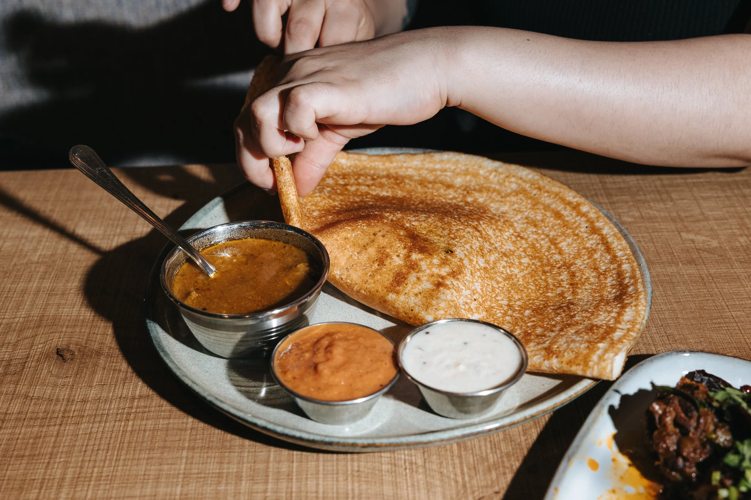 Crispy South Indian dosa served with sambar and chutneys at Veda in Kitsilano, Vancouver.