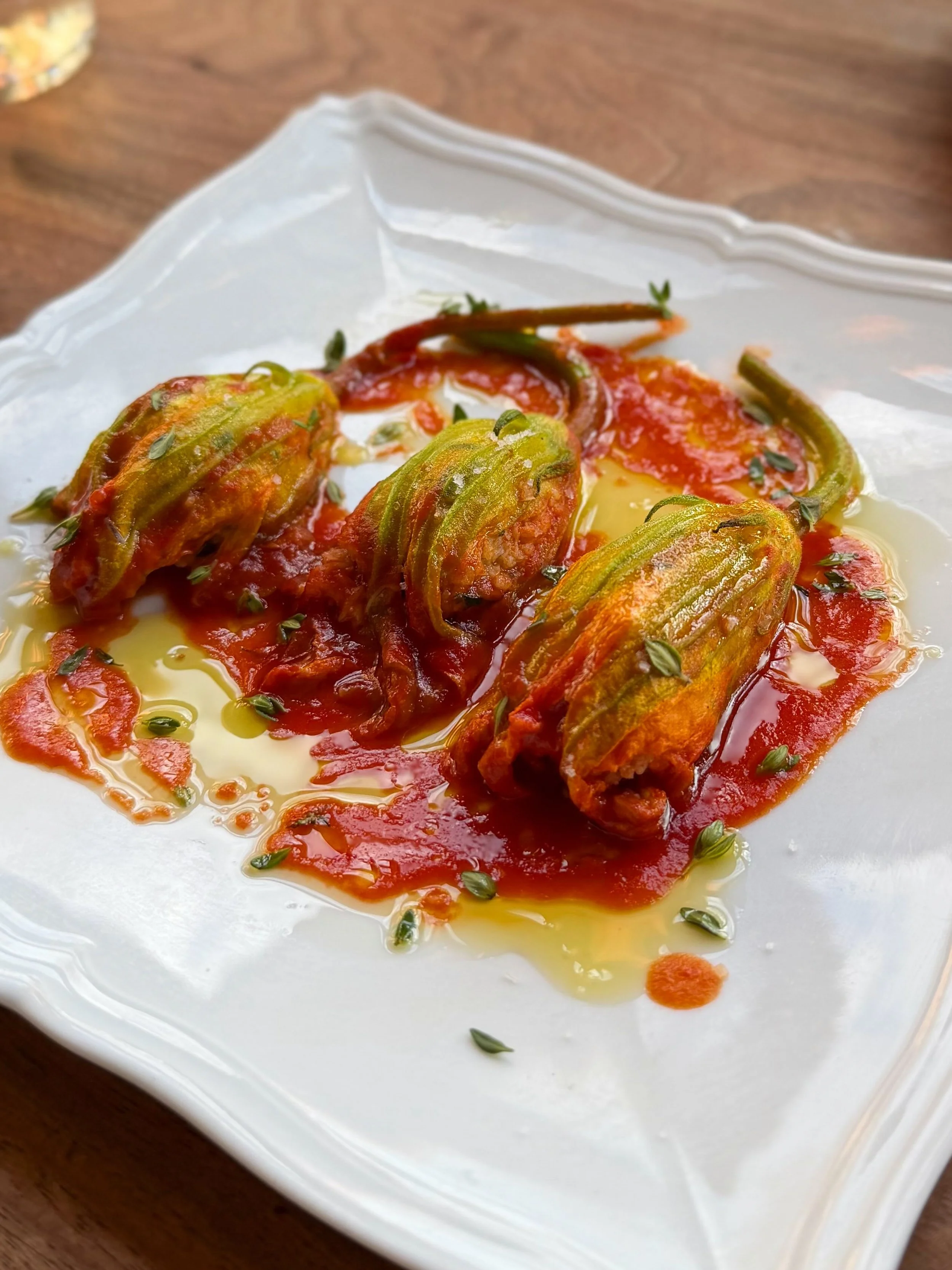 Some of my favourite eats recently 🍽️ 

-Crab stuffed squash blossoms, tomato jus @the.tasting.kitchen 

-Tagliolini, squid, serrano, white wine butter, shrimp tea @the.tasting.kitchen 

-Melon Salad @betsynotbetsys 

-insane cheese from @blakesvill