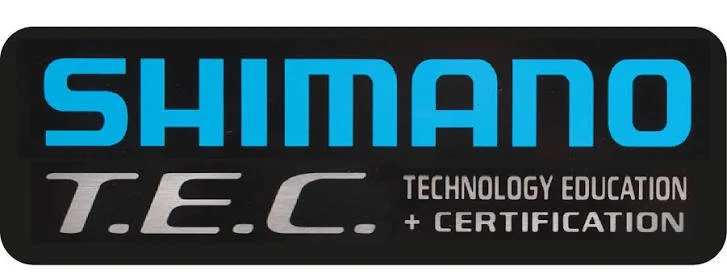 Shimano T.E.C. Technology Education + Certification logo on a black rounded rectangle